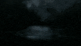 a computer generated image of a waterfall with a dark background