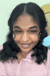 a close up of a woman 's face with a smile on her face