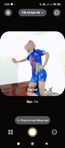 a person in a spiderman shirt is standing in front of a white wall