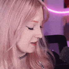 a close up of a woman wearing a choker and a microphone