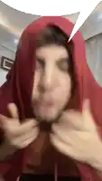 a man with a red scarf around his head has a speech bubble above him