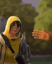 a woman in a yellow hoodie is talking to a man