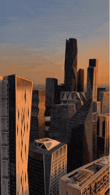 an aerial view of a city at sunset