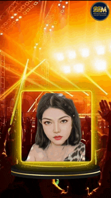 a woman 's face is displayed in front of a crowd of people and a logo that says sgm