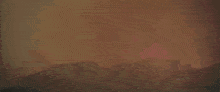 a large rock is being destroyed by a huge explosion .