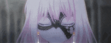 a girl with white hair is wearing a mask with a butterfly on it .