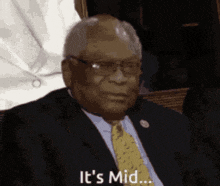 a man in a suit and tie says it 's mid ...