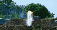 a large explosion is coming out of the ground