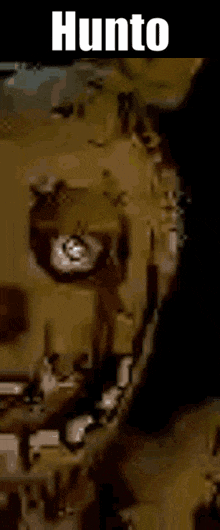 a close up of a person 's face with the words hunto written on the bottom