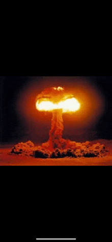 a nuclear explosion with a mushroom cloud coming out of it