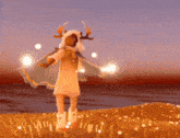 a girl with antlers on her head is standing in a field holding a sword .