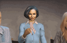 a woman wearing a blue shirt and pink scarf