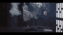 a storm trooper is flying through the air in a room with smoke coming out of the ceiling .