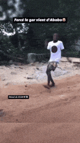 a man in a white shirt is dancing in the dirt with the caption force le gar vient d'abobo