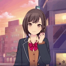 a girl in a school uniform with a red bow tie is standing in front of a building that says japan