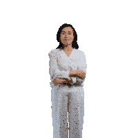 a woman in a white shirt and white pants holds her arms outstretched