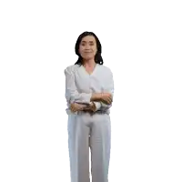 a woman in a white shirt and white pants holds her arms outstretched