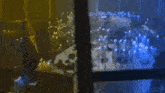 a man is standing in front of a table with candles on it .