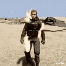 a man in a black suit is walking in the desert with a flame coming out of his pants