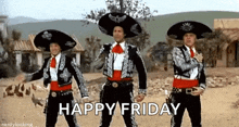 three men in mariachi costumes are dancing in a desert with the words `` happy friday '' written below them .