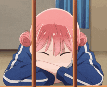 a girl with pink hair is laying on the floor