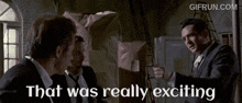 a gif from gifrun.com shows three men in suits and ties