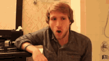 a man making a funny face in a bathroom