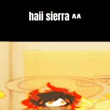 a cartoon character with red horns and the words haii sierra written on it .