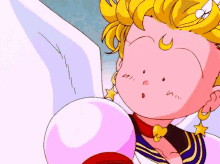 a close up of a cartoon character holding a pink bubble