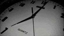a close up of a quartz clock with the hands on the numbers 7 and 1