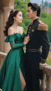 a woman in a green dress is standing next to a man in a black uniform .