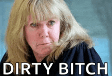 a close up of a woman 's face with the words dirty bitch written below her