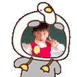 a cartoon of a child wearing a duck costume with a duck head .