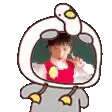 a cartoon of a child wearing a duck costume with a duck head .