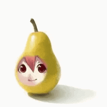 a pear with a face on it is sitting on a table .