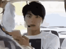 Jin Closing His Flip Phone GIF