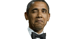 a man in a tuxedo and bow tie is making a face