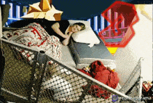a woman is laying on a bed with a fence behind her and the words redheadorama on the bottom