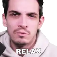 a man with a beard and a white hoodie says relax