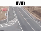 a black van is driving down a highway with the word nvm on the bottom