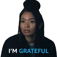 a woman with dreadlocks says i 'm grateful in blue
