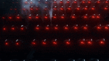 a close up of a circular object with red dots on it