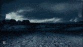 a man is walking in front of a lightning storm with the caption capcut