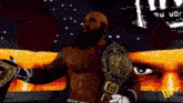 a bald man with a beard is wearing a wrestling belt