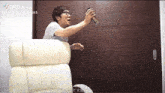 a man sitting in a chair with a can of soda in his hand and a tik tok watermark