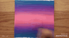 a person is painting a cloud on a canvas with a made in animatica logo
