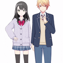 a boy and a girl standing next to each other wearing school uniforms