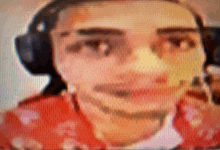 a blurry picture of a man 's face with headphones on