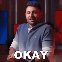 a man wearing a hollister sweatshirt says " okay "