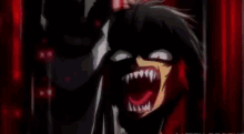 a close up of a person 's face with red blood coming out of it 's mouth .